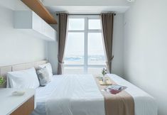 卧室 5 Homey and Warm 1BR Apartment Vasanta Innopark By Travelio