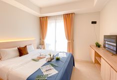 Bedroom 2 New Furnished Studio Apartment at Gold Coast By Travelio