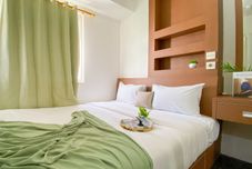Bedroom Elegant and Good Choice 2BR at Green Pramuka City Apartment By Travelio