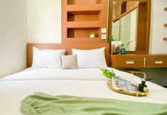 Bedroom 2 Elegant and Good Choice 2BR at Green Pramuka City Apartment By Travelio