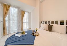 침실 3 Simply and Restful Studio at Tokyo Riverside PIK 2 Apartment By Travelio