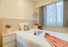 Bedroom 2 Minimalist and Comfortable 2BR at Meikarta Apartment By Travelio
