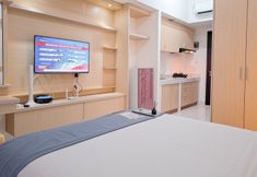Bedroom 4 Cozy and Good Furnished Studio at Casa de Parco Apartment By Travelio