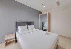 Bedroom 4 Well Furnished and Nice 1BR at Patraland Amarta Apartment By Travelio