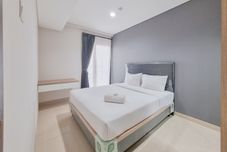 Bedroom Well Furnished and Nice 1BR at Patraland Amarta Apartment By Travelio