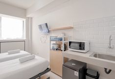 ห้องนอน 3 Pleasant Studio (No Kitchen) at Apartment Bandaraya - Tallasa City Makassar By Travelio