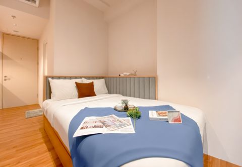 Bedroom Warm and Neat Studio at Tokyo Riverside PIK 2 Apartment By Travelio