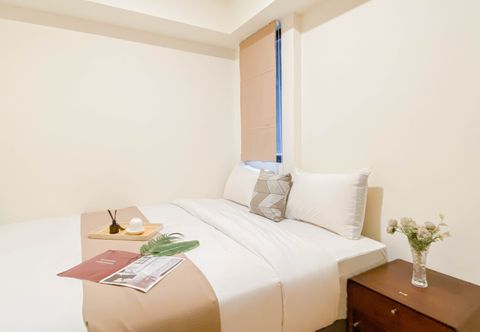 Bedroom Cozy and Warm 1BR with Makeup Room at Meikarta Apartment By Travelio