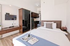 Phòng ngủ Comfy Rustic Studio at Casa De Parco Apartment By Travelio