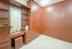 Bedroom 2 Comfy and Combined 1BR with Extra Room Apartment at Green Pramuka City By Travelio