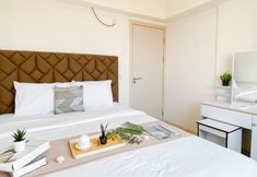 Bedroom 2 2BR Apartment near Pelita Bangsa University at Meikarta By Travelio