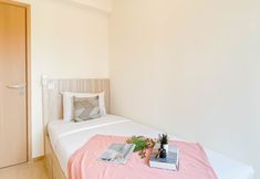 Bedroom 7 Spacious 3BR Apartment with Neutral Toned at Meikarta By Travelio