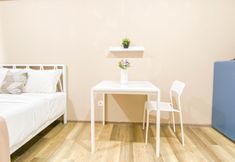 Bedroom 4 Soft Minimalist Studio Room at Apartment Meikarta By Travelio