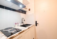 Common Space 5 Wooden Accent Studio at Tokyo Riverside PIK 2 Apartment By Travelio