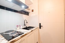 Common Space Wooden Accent Studio at Tokyo Riverside PIK 2 Apartment By Travelio