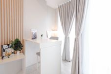 Lobby Wooden Accent Studio at Tokyo Riverside PIK 2 Apartment By Travelio