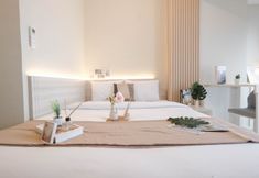 Bedroom 3 Wooden Accent Studio at Tokyo Riverside PIK 2 Apartment By Travelio