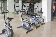 Fitness Center Modern and Homey 2BR at Patraland Urbano Apartment By Travelio