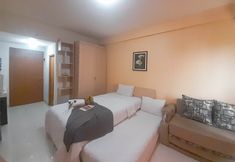 Bedroom 2 Serenity Studio at Apartment Pinewood By Travelio