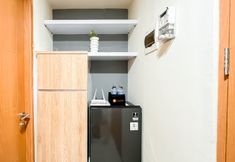 Common Space 6 Wooden Nest 2BR Without Living Room at Apartment Evenciio Margonda By Travelio