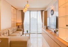 Ruang Umum 3 Warm Contemporary 2BR at Apartment Samara Suites By Travelio