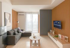 Common Space 3 Modern Monochromatic 2BR near LRT Station at Samara Suites Apartment By Travelio