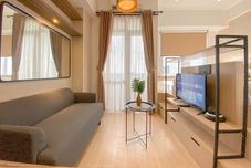 Ruang Umum Tranquil and Cozy Studio Apartment Vasanta Innopark By Travelio