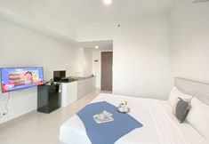 寝室 3 Simple White Designed Studio at Apartment LRT City Bekasi By Travelio