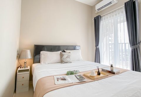 Bedroom Soft Grey 1BR at Apartment Royal Sentul Park By Travelio