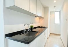 Common Space 4 Monochrome Style 1BR at Apartment Branz BSD City By Travelio