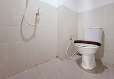 In-room Bathroom 6 Pop Color Touch and Modern 2BR at Urbantown Serpong Apartment By Travelio