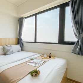 Bedroom 1 Spacious Warm 2BR at Meikarta Apartment By Travelio, Telaga Seafood Cikarang Restaurant Hotels