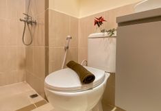 In-room Bathroom 7 Spacious Warm 2BR at Meikarta Apartment By Travelio