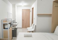 Bedroom 4 Basic Studio (No Kitchen) at Bandaraya Apartment - Tallasa City Makassar By Travelio