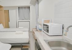 Bedroom 3 Basic Studio (No Kitchen) at Bandaraya Apartment - Tallasa City Makassar By Travelio