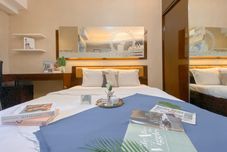 Bedroom Well Furnished Studio at Green Bay Pluit Apartment with Seaview By Travelio
