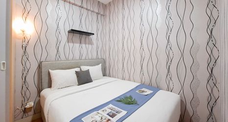 Bedroom 2 Simple 2BR near Cisauk Station at Serpong Garden Apartment By Travelio
