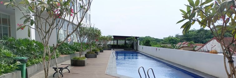 Lobby Simple 2BR near Cisauk Station at Serpong Garden Apartment By Travelio