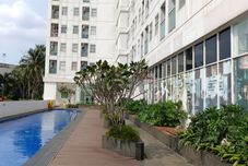 Swimming Pool Simple 2BR near Cisauk Station at Serpong Garden Apartment By Travelio