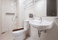 In-room Bathroom 6 Simple 2BR near Cisauk Station at Serpong Garden Apartment By Travelio