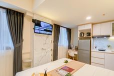 卧室 Simply Look and Warm Studio at Meikarta By Apartment Travelio