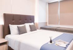 Bedroom 2 Cozy Living and Trendy 1BR at Collins Boulevard Apartment By Travelio