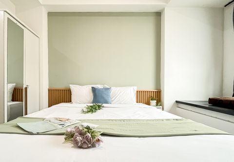침실 Comfy Ivory Studio at Collins Boulevard Apartment By Travelio
