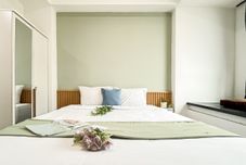 침실 Comfy Ivory Studio at Collins Boulevard Apartment By Travelio
