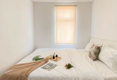 Bedroom 2 Chic 1BR at Apartment Vittoria Residence By Travelio