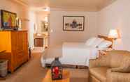 ห้องนอน 6 Coachman Inn & Suites
