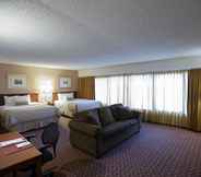 Bedroom 5 Ramada Hotel & Convention Center by Wyndham Topeka Downtown