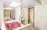 In-room Bathroom 7 Ramada by Wyndham Niagara Falls by the River