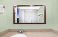 In-room Bathroom 6 Days Inn & Suites by Wyndham SE Columbia Ft Jackson