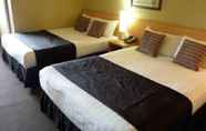 Kamar Tidur 5 The Ashley Hotel